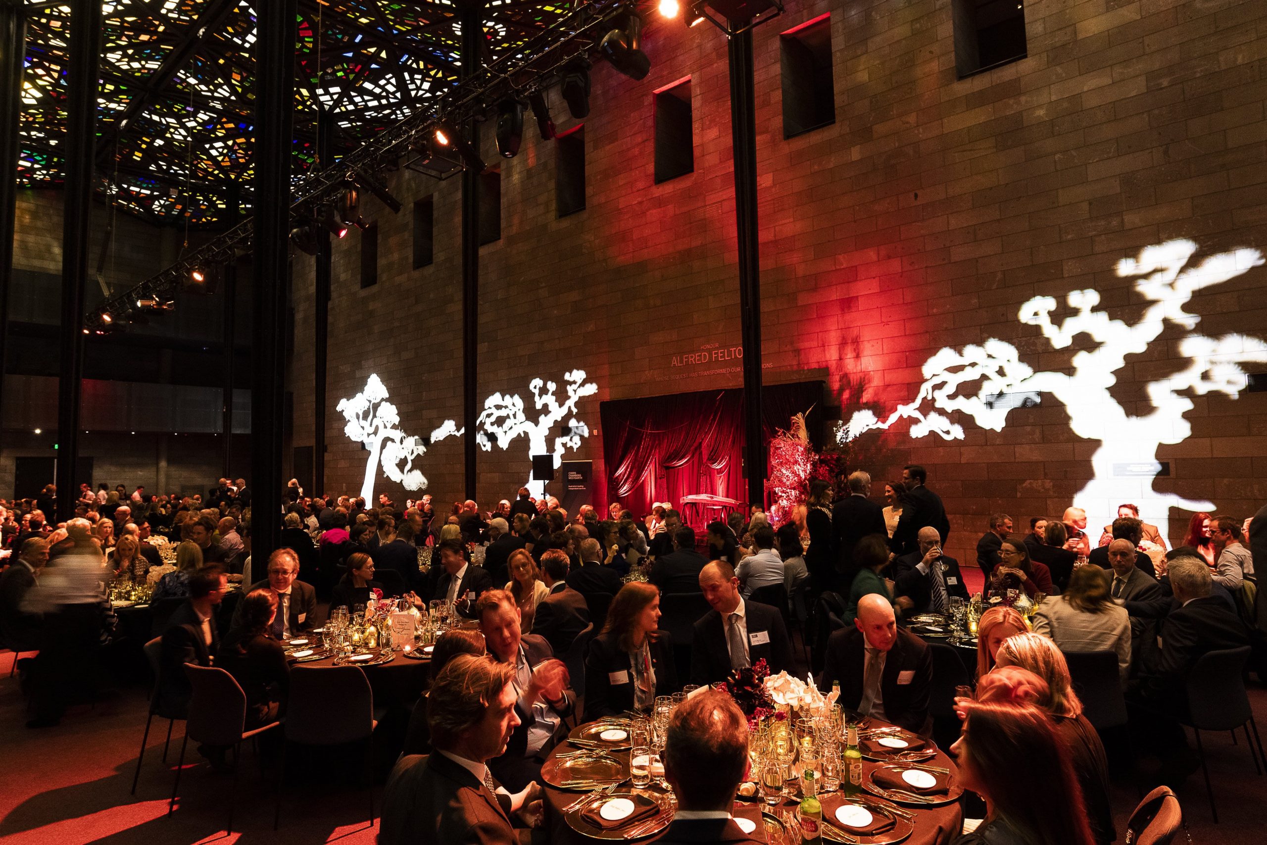 people seated at an awards night hosted by alive