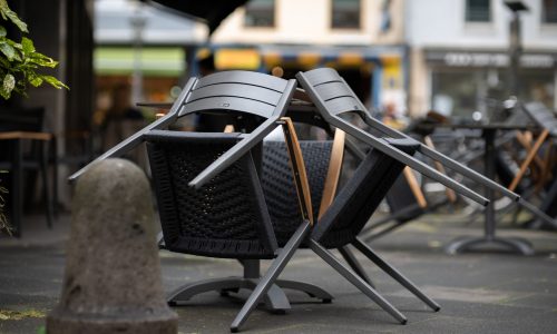 chairs packed away infront of closed restaurant