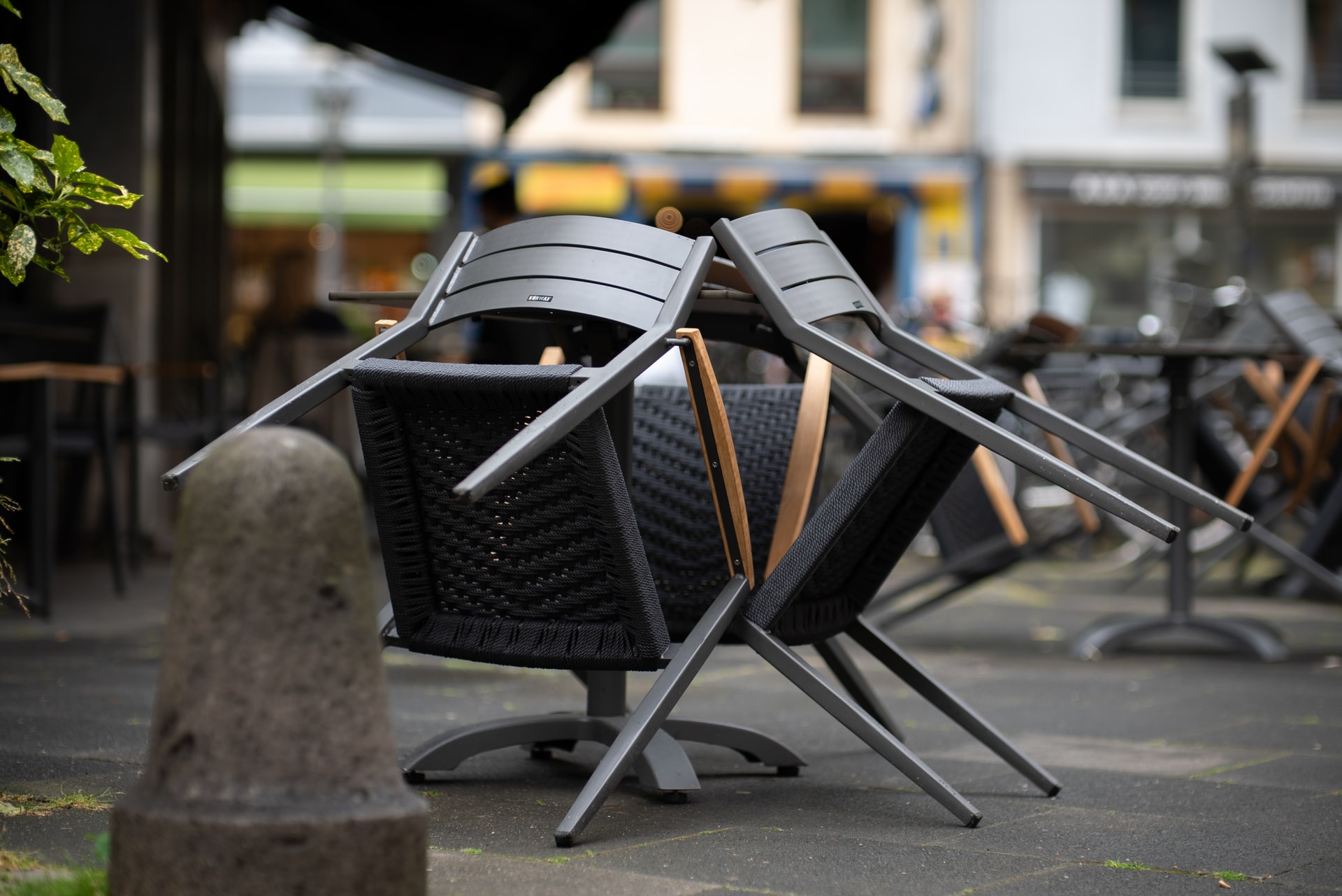 chairs packed away infront of closed restaurant